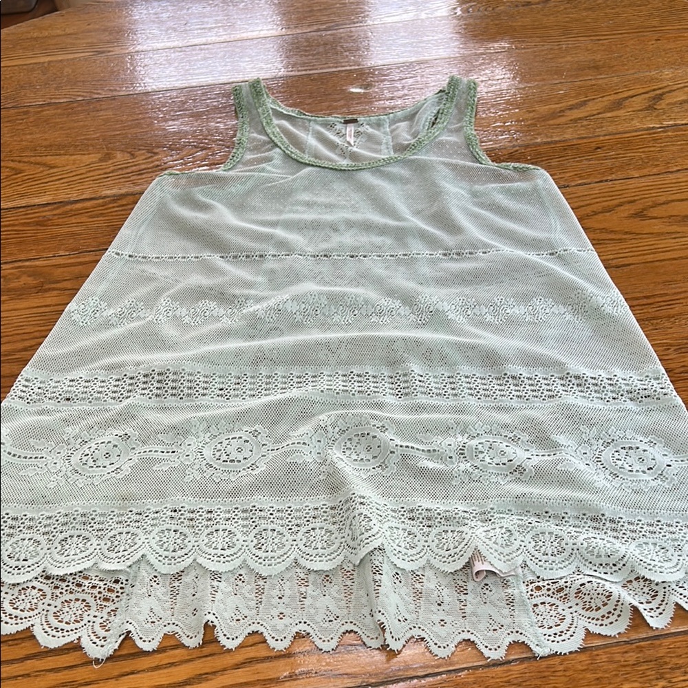 Free People mint green lace racerback tank top with crochet details. Size Medium